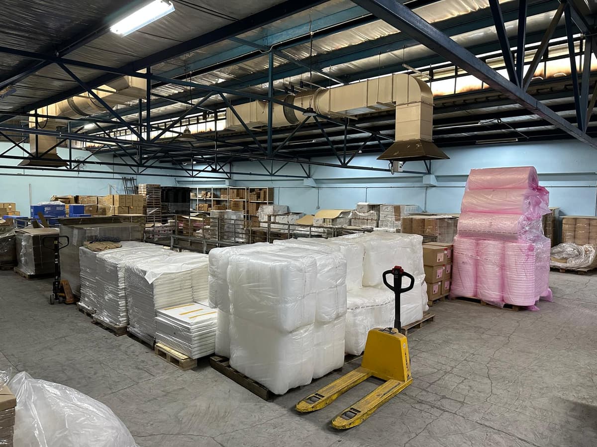 Megapac warehouse — wide interior view of operations floor with palletised stock