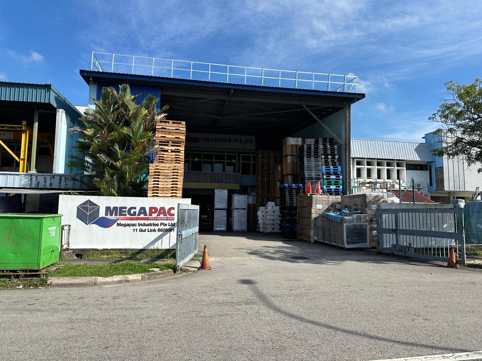 Megapac Industries facility exterior at 11 Gul Link — entrance with pallets and signage